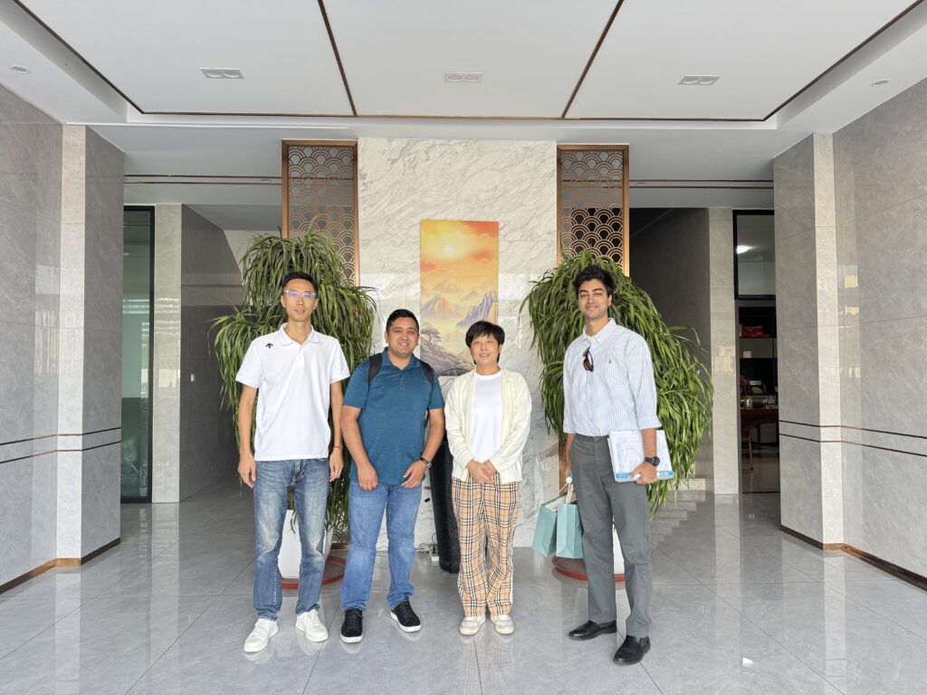 Nepal customers visiting LEBON textile machinery factory in Qingdao, China, inspecting the microfiber polyester wadding production line.